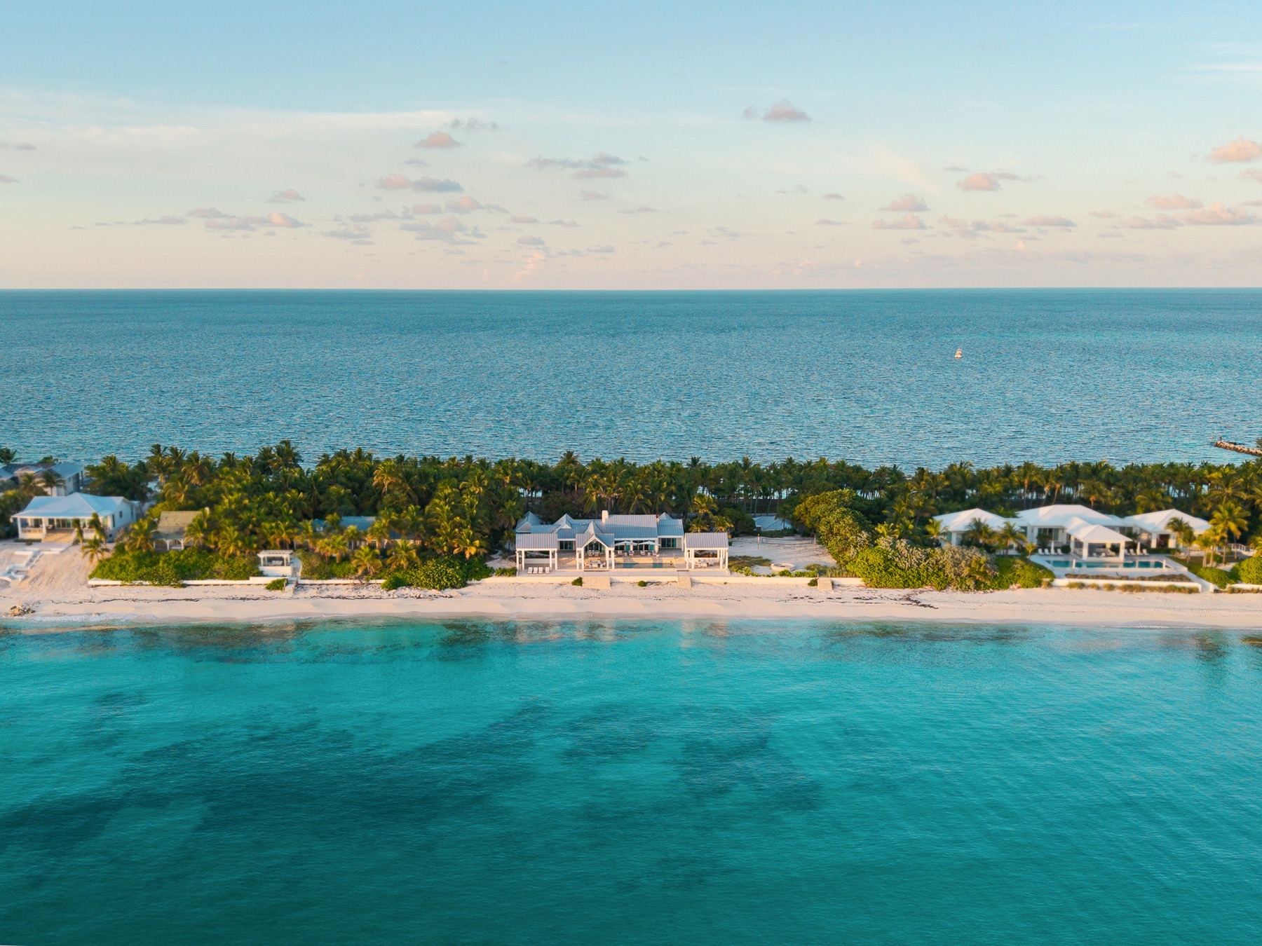 Aerial of estate on the shoreline with open ocean