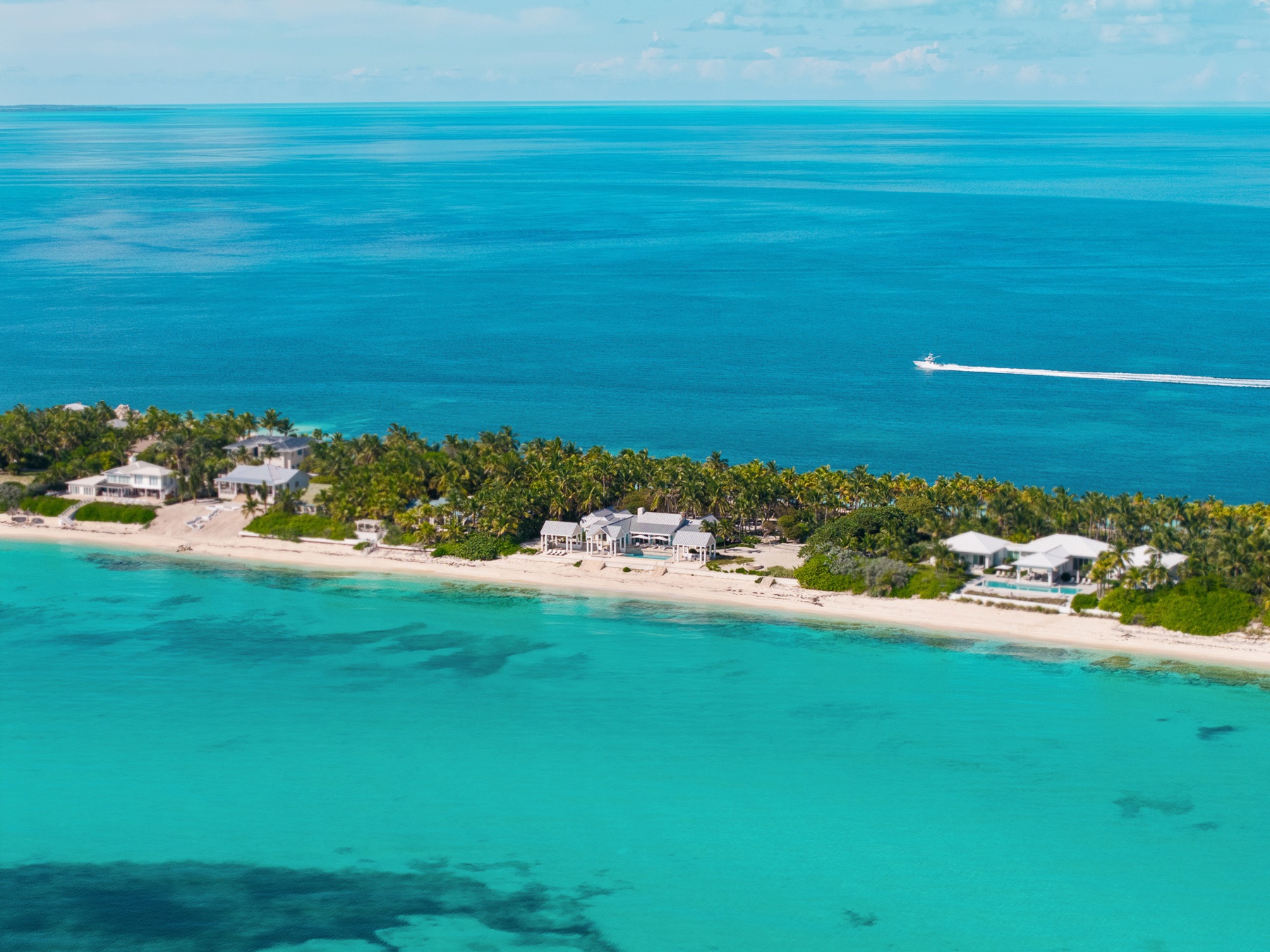 Aerial of the point with turquoise reef